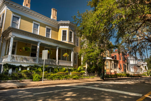 istock Old classical homes on a Savannah Georgia USA road 1415224206