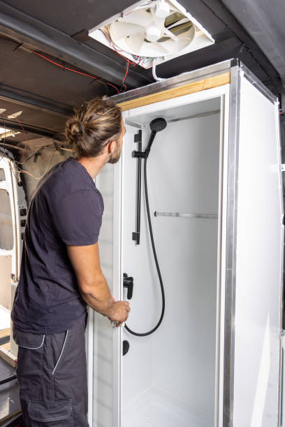 istock Man building a shower room inside a camper van 1415224326