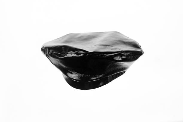 istock black leather beret isolated on white background 1415224370