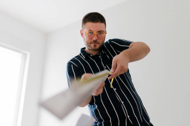 istock Young man renovating his house 1415227148
