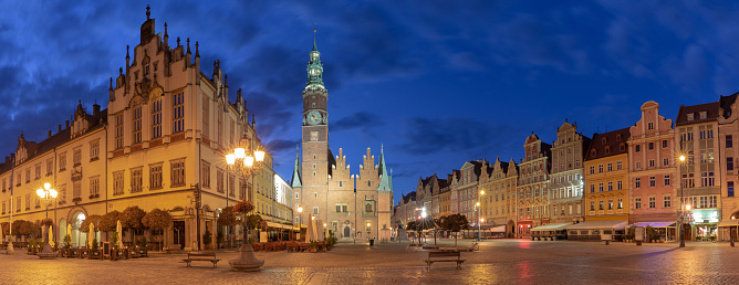 Panoramic view of the market square in the early morning in night illumination. Wroclaw. Poland.