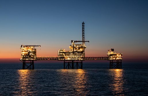 Oilfield in sunset