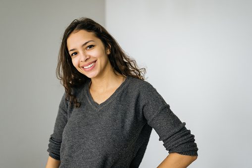 Portrait of a positive young woman indoor