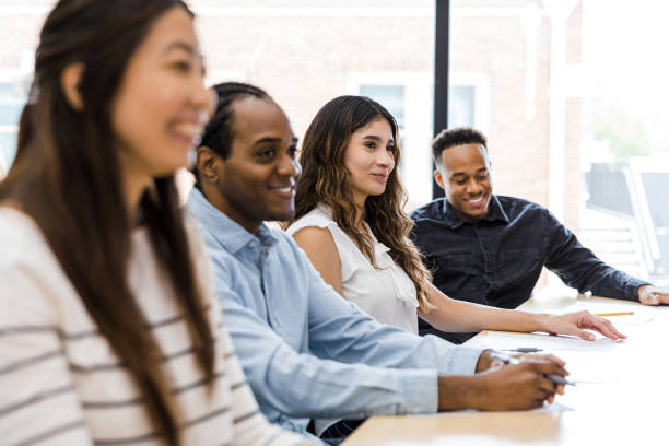 istock Smiling group of diverse students wait for class to start 1415231330