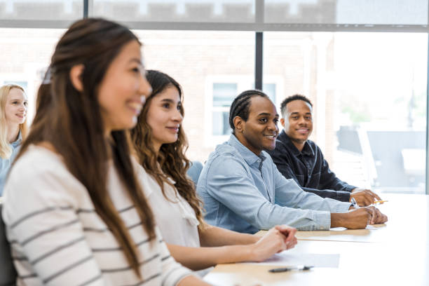 business men and women attend seminar - chinese ethnicity latin american and hispanic ethnicity multi ethnic group business person imagens e fotografias de stock