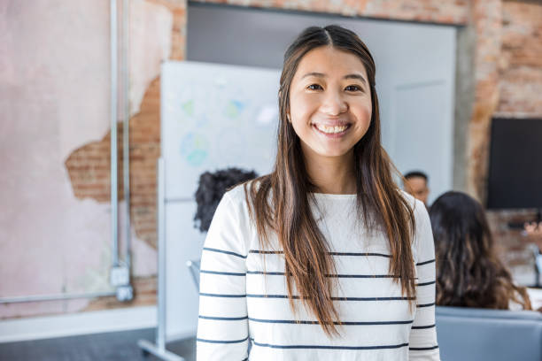istock Female professor smiles for camera 1415231396