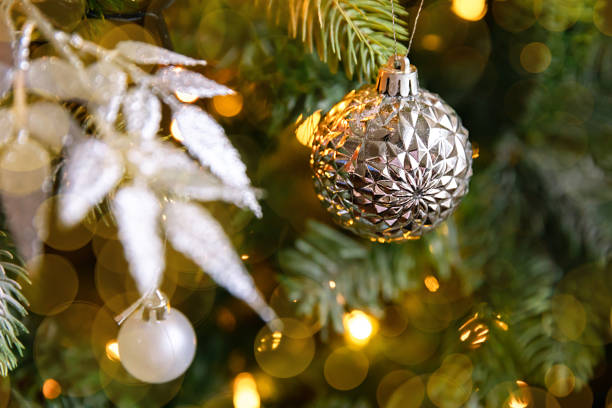 istock Classic Christmas decorated New year tree. Christmas tree with wite and silver decorations, ornaments toy and ball. Modern classical style interior design apartment. Christmas eve at home. 1415231815