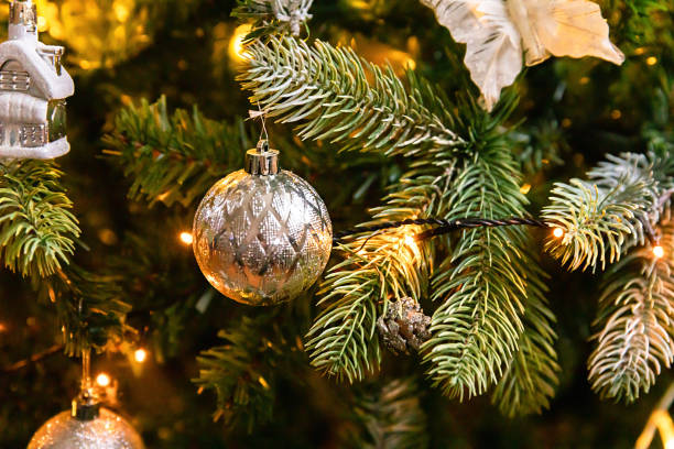 istock Classic Christmas decorated New year tree. Christmas tree with wite and silver decorations, ornaments toy and ball. Modern classical style interior design apartment. Christmas eve at home. 1415231816
