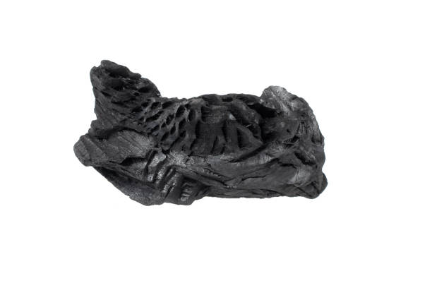 istock pieces of charcoal on a white isolated background 1415236157