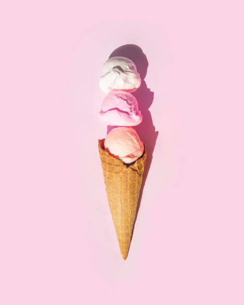 istock Pastel light ice cream balls in cone on light pastel pink background. Creative food concept. Minimalistic sweets composition. Sunny summer idea. 1415236279