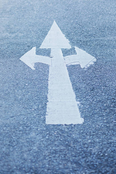 istock Three headed arrow symbol on street 1415236285