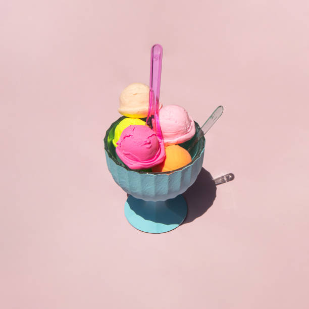 istock Pastel light ice cream balls in cup on light pastel pink background. Creative food concept. Minimalistic sweets composition. Sunny summer day idea. 1415237193