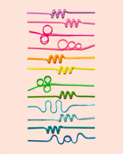 istock Drinking straws on bright pink background. Minimal cocktail concept. Colorful drink composition. 1415237401