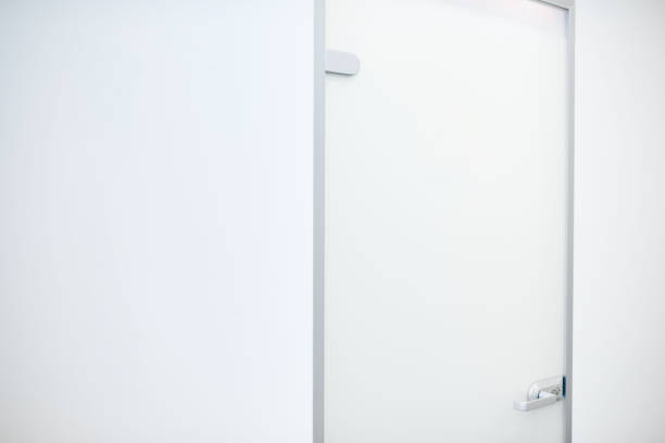 istock white door in the white modern office 1415239152