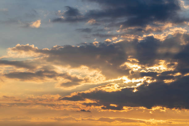 istock Dramatic clouds in the sky illuminated by the sun. 1415239197