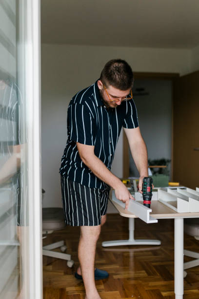 istock Young man renovating his house 1415240355