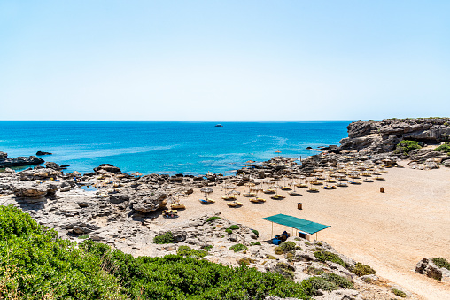 Famous Kokkini beach in Kallithea town of Rhodes Island, Greece. Rocky coast view.