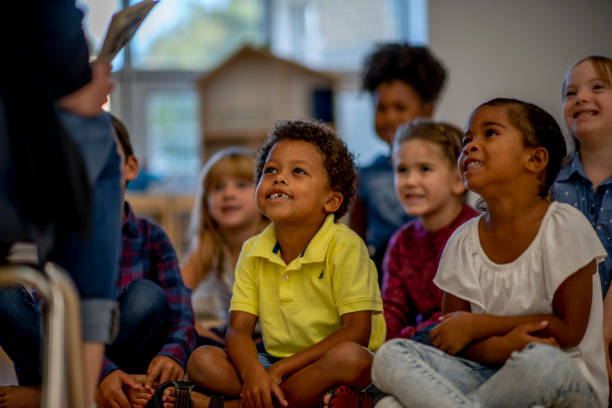 istock Kindergarten Students Listening to a Story 1415241605