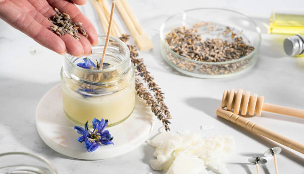 istock Set tools for homemade natural eco-friendly soy wax candles, wick, perfume, essential oil on a marble table. Making process. Trendy DIY. Craft hobby, small business, artisan products concept 1415242561