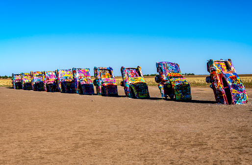 Cadillac Ranch, an iconic stop on Route 66, is an art installation and a  popular landmark. It was created in 1974. Ten Cadillacs are partially buried nose down in the ground. Visitors spray paint their random art and graffiti, resulting in a constantly evolving artistic expression
Amarillo, TX
05/09/2022