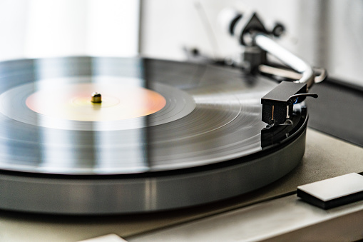 Turntable plays a vinyl record