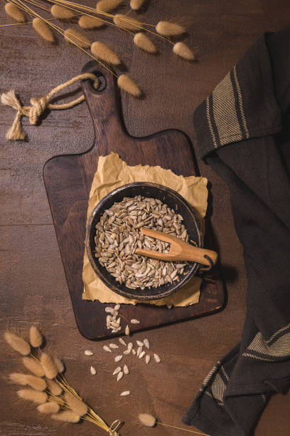 istock Sunflower seeds in a ceramic bowl 1415245073