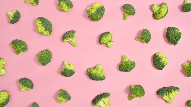 istock Broccoli creative pattern on pastel pink background. Healthy food vegetables concept. Flat lay 1415245633