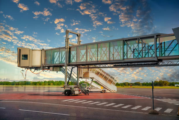 jet bridge from an airport terminal gate. - jet way imagens e fotografias de stock