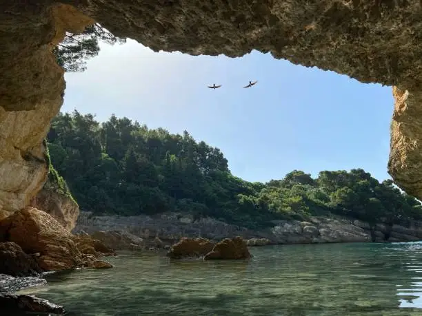 Photo of Beautiful sea bay among scenic rocks. Serenity. Solitude. Amazing nature of Mediterranean coast at summer.