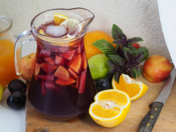 istock Pitcher with sangria, oranges, peaches, apples, lemons 1415249993