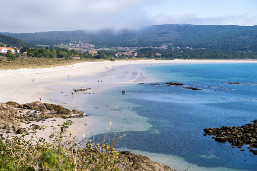Panoramic view of Praia da Langosteira, one of the most touristic beaches of Fisterra in A Coruña, Spain.