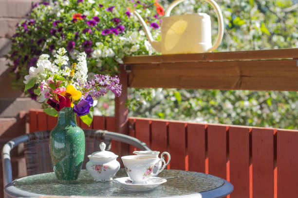 istock cofee set on the  cofee litle table in the banch in summer sunny day 1415250163