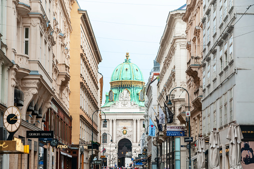Kohlmarkt street and  Hofburg palace in background, in Vienna, Austria. August 8, 2022.