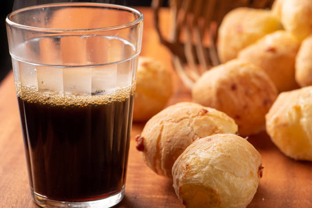 istock Cheese bread, beautiful cheese breads on rustic wood and a cup of hot coffee. selective focus. 1415252584