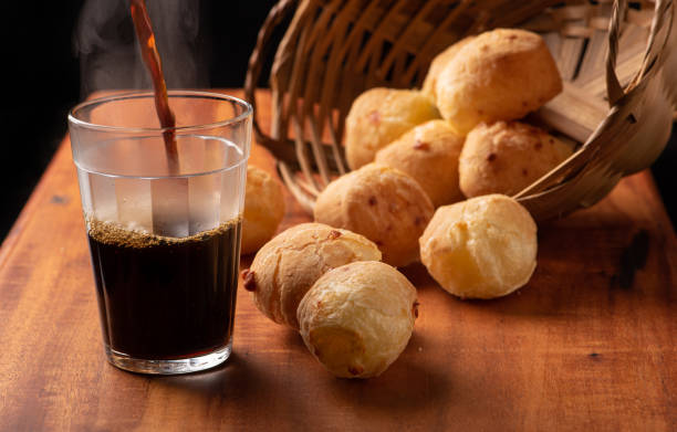 istock Cheese bread, beautiful cheese breads on rustic wood and a cup of hot coffee. selective focus. 1415252591