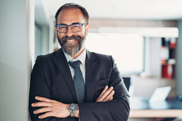 istock Smiling businessman in his office 1415253926