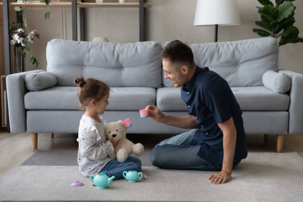 istock Happy little kid playing with caring father. 1415255235