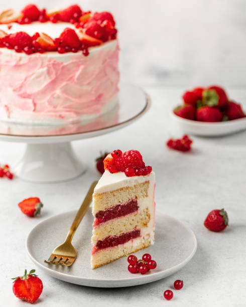 Strawberry cake, strawberry sponge cake with fresh strawberries and sour cream on a white background stock photo