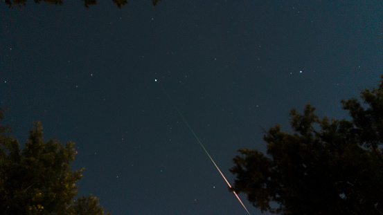 Olney, MD, USA - August 12, 2022: Image is of a Meteor from the Perseids Meteor. The image is taken at 11:34 PM EST with a time-lapse camera capturing individual images with an 8 sec exposure.