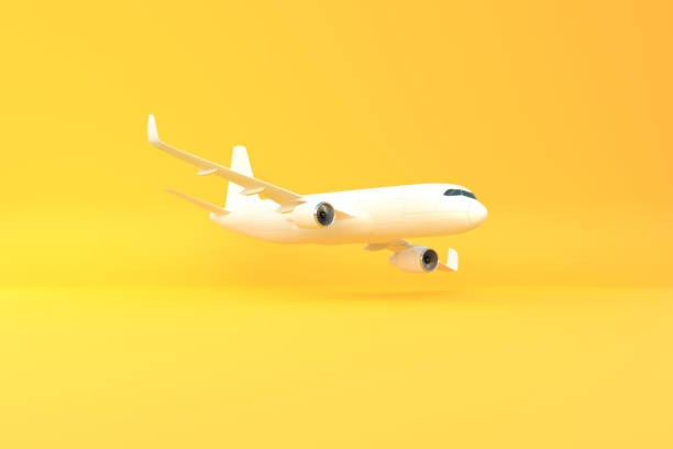istock Airplane on a yellow background with copy space 1415259598