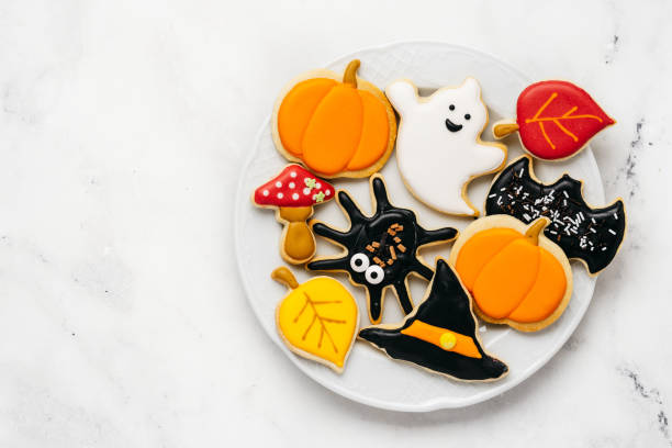 istock Halloween sugar cookies - pumpkin, ghosts, witch hat, spider in a plate 1415260356