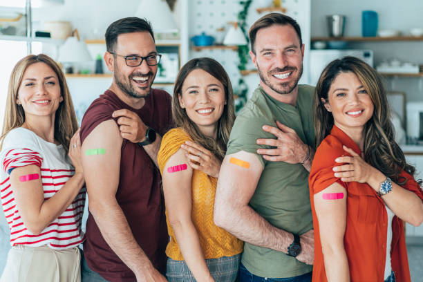 istock Friends showing their arms after getting vaccinated 1415260671