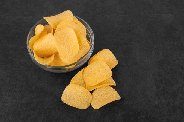 istock Potato chips in a saucer 1415263225