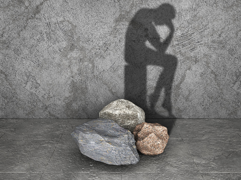 Rocks cast shadow in form of thinker. 3d illustration