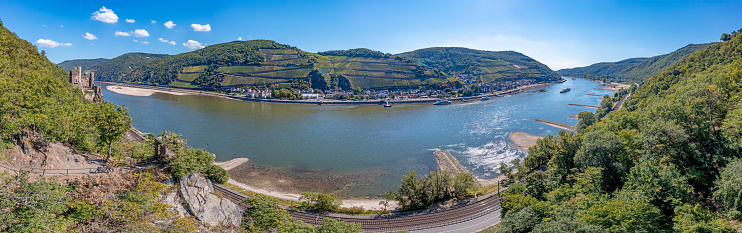 Drone panorama over the Rhine near Assmannshausen with Rheinstein Castle at record low water in summer 2022