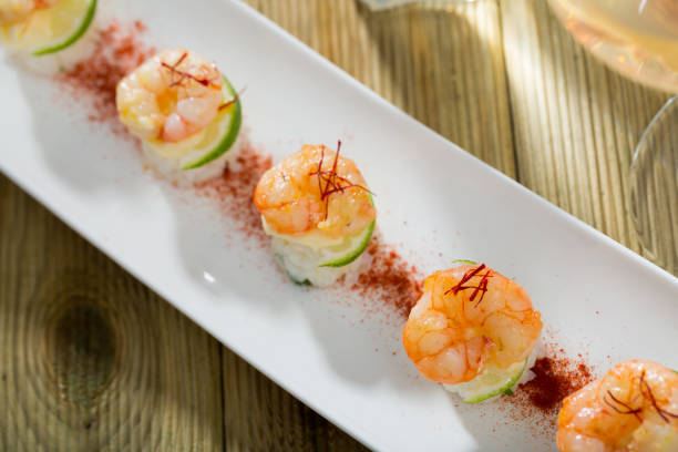 istock Fried shrimps on rice with lime and saffron 1415268392