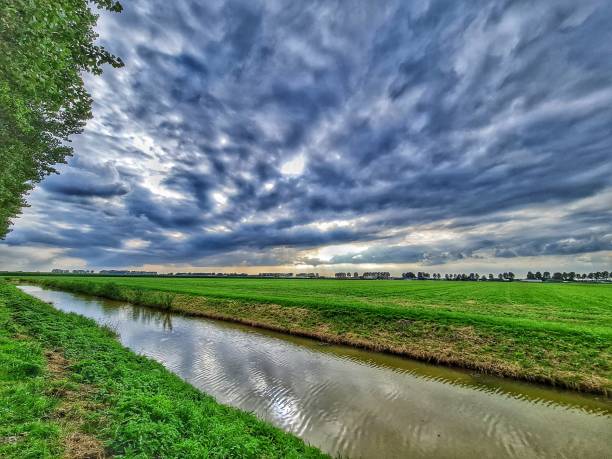 istock Dark clouds above the field 1415271698