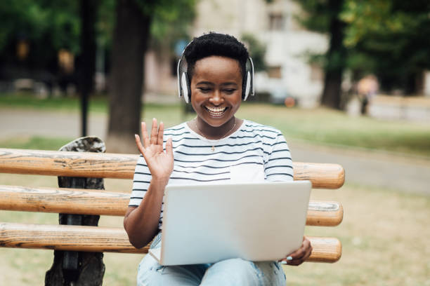 istock African American female freelancer working online from the park 1415273741