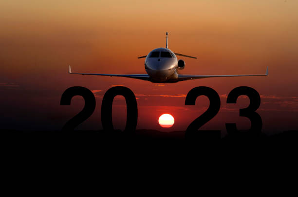 New year 2023 concept with private plane stock photo