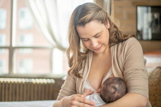 istock Mother Nursing her Infant 1415279630